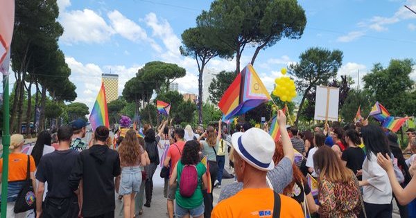 Crowds wave rainbow flags at a large Pride celebration in Brazil