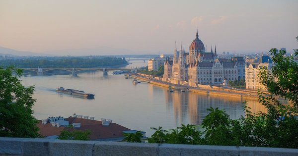 Crowds gathered near the Hungarian Parliament building in Budapest for a Pride march