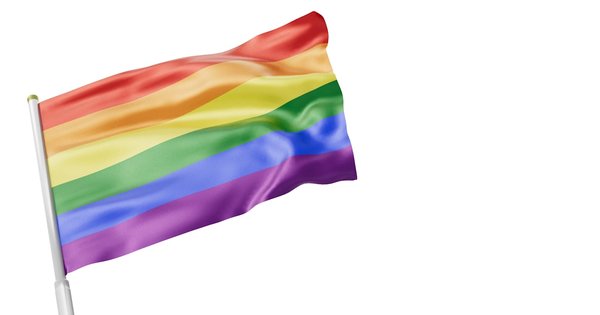 A Pride flag flying alongside the blue-and-gold flag of the European Union