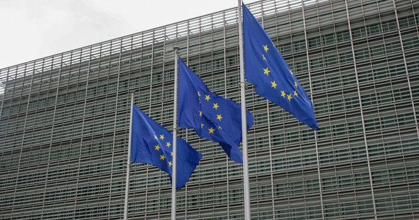European Union flags flying outside an EU institution building