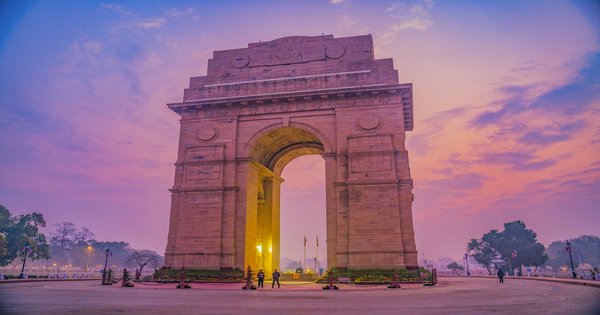 India Gate monument in New Delhi illuminated at sunset