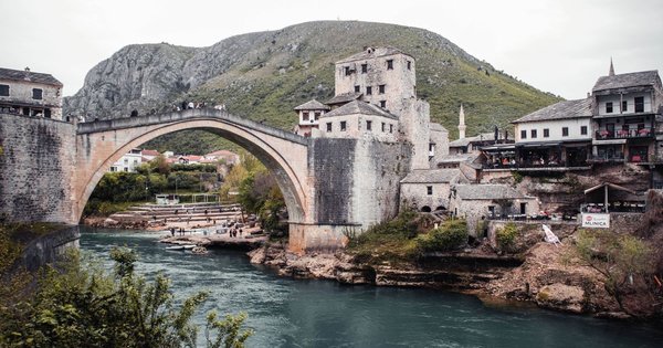 The Stari Most stone bridge arching over the Neretva River in Mostar's old town