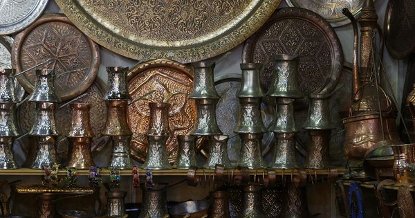 View of Sarajevo's old town and minarets from the surrounding hills at sunset