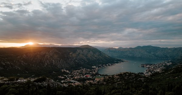 The waterfront and old town of Kotor, Montenegro, with mountains in the background