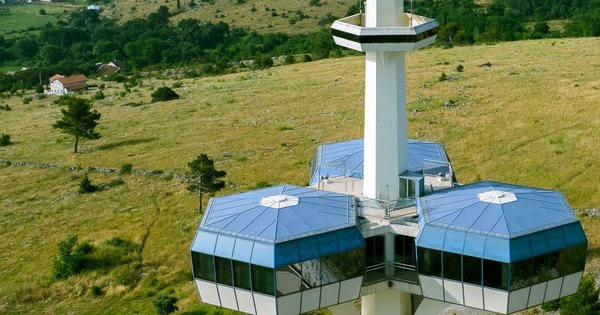 The hilltop telecommunications tower above Podgorica, Montenegro, set in green countryside