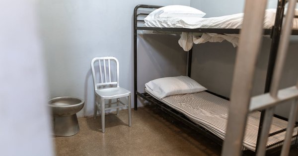 A row of bunk beds inside a prison cell block