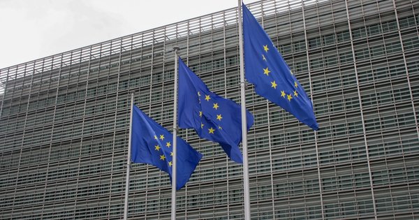European Union flags outside an EU institutional building in Brussels