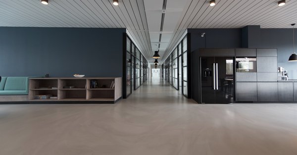 An empty hallway in an institutional building, symbolizing the isolation faced by youth in care