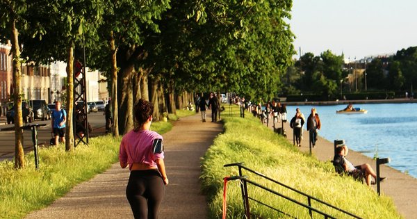 Runners lined up at the start of a parkrun event in a UK park