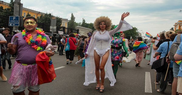A Pride flag held up at a demonstration in Kyiv, Ukraine