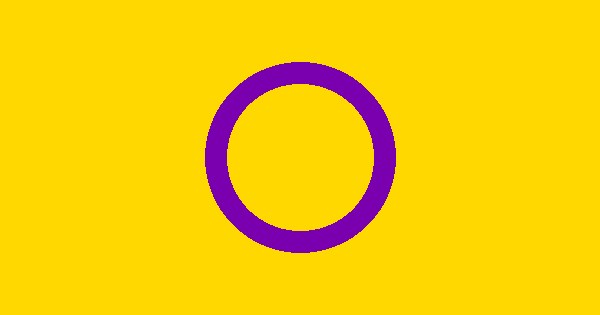 The intersex pride flag — yellow with a purple circle — against a bright sky.